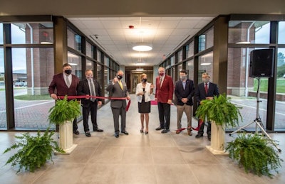 Administrators and partners commemorated the opening of Mississippi State’s Poultry Science Building with a ribbon-cutting ceremony on November 9. Pictured, left to right, are Gary Jackson, director of the MSU Extension Service; Scott Willard, interim dean of MSU’s College of Agriculture and Life Sciences; MSU President Mark E. Keenum; Mary Beck, poultry science department head; Reuben Moore, interim vice president of the Division of Agriculture, Forestry and Veterinary Medicine and interim director of the Mississippi Agricultural and Forestry Experiment Station; Justin Harrington, architect at McCarty Architects; and David Howell, MAFES engineer. (Megan Bean)