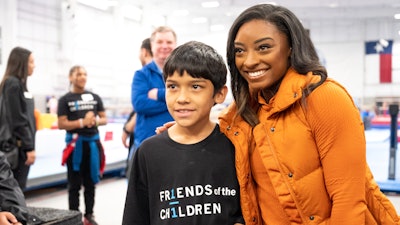 Nulo's ambassador Simone Biles is a longtime advocate for children and supporter of family pets.