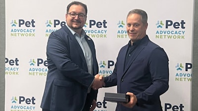 Michael Landa, Nulo Pet Food, received the Power of Pets Award from Mike Bober, president and CEO of PAN.